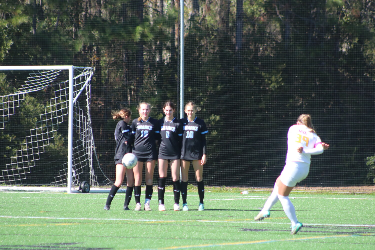 A wall of Ponte Vedra players stand tall during a free kick.